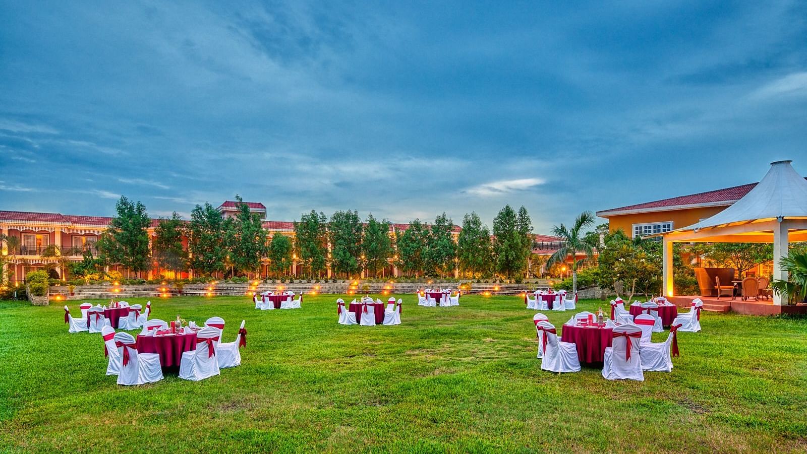 Seating arrangement in a lawn at Swosti Resorts during the day
