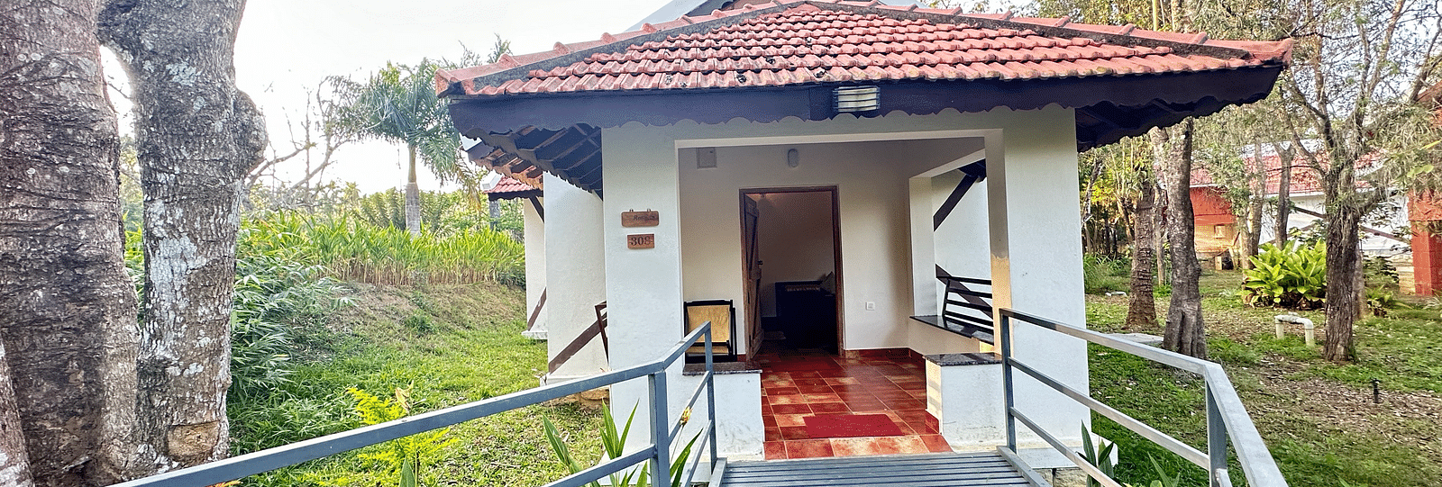 entrance to the property with steps leading up to the entrance - Kadkani River Resort, Coorg