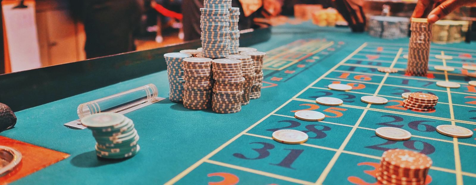 poker chips placed on a blue poker table