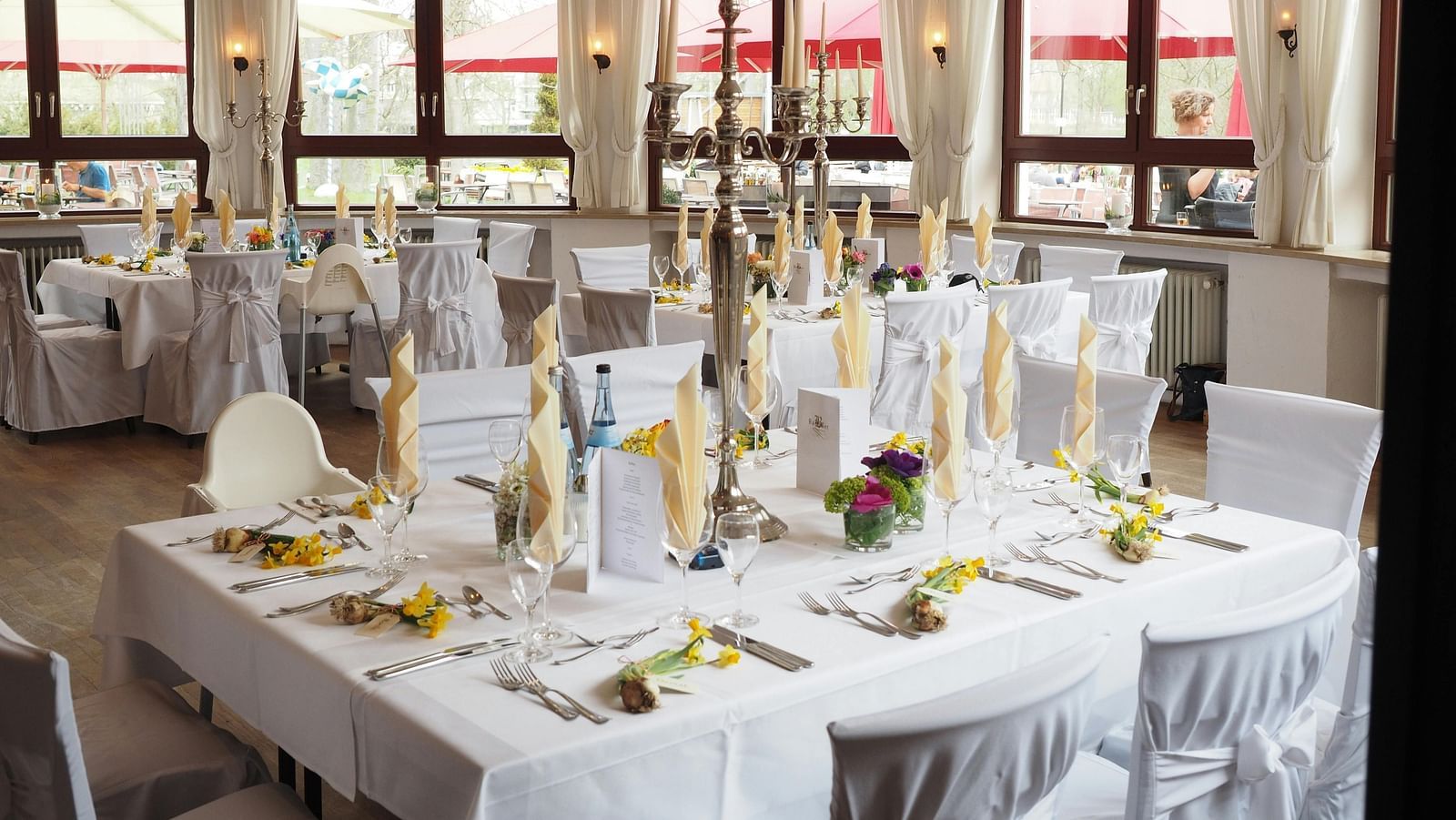 tables and chairs placed in clusters in a hall