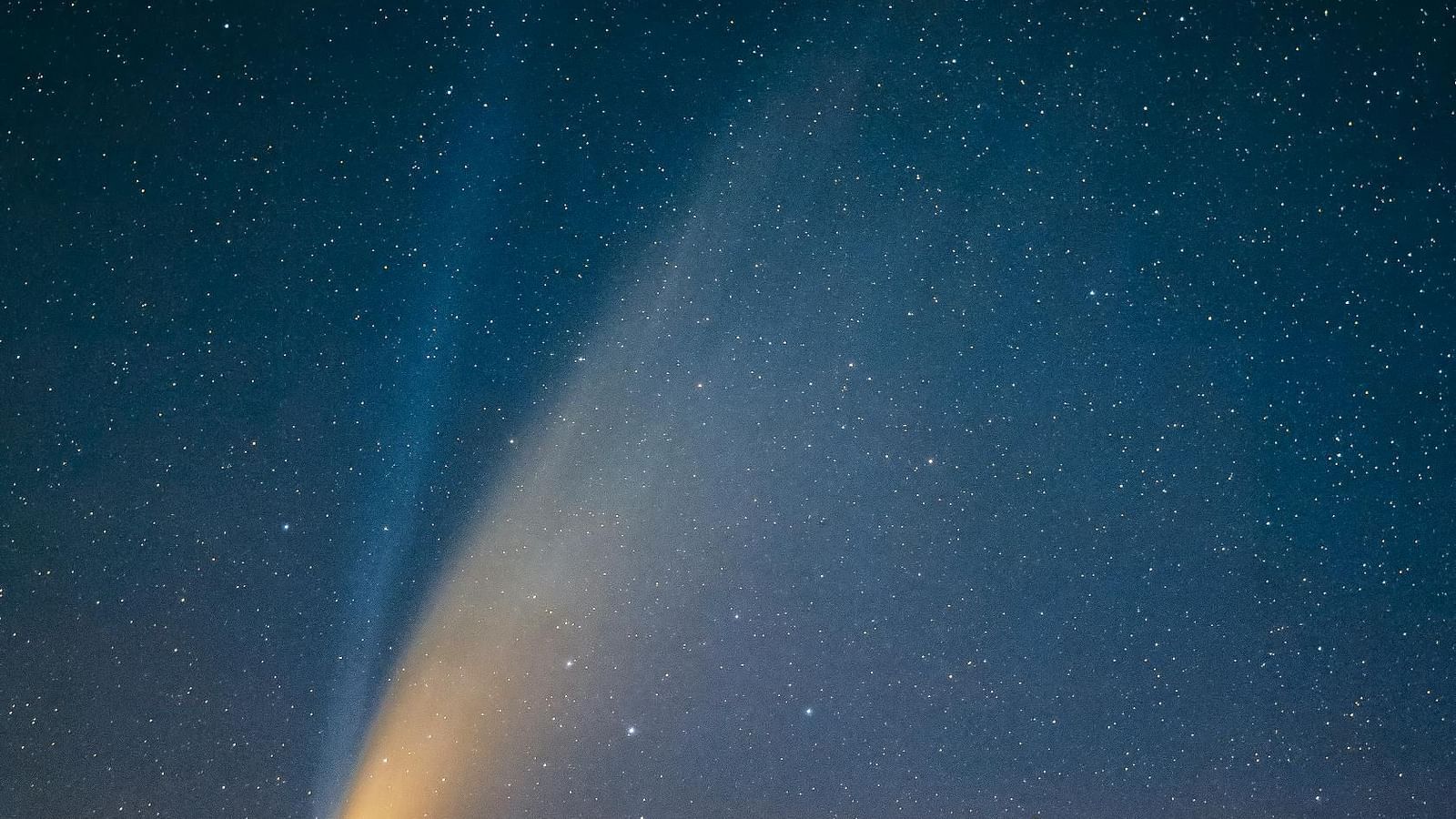 A bright streak of light against a dark background.
