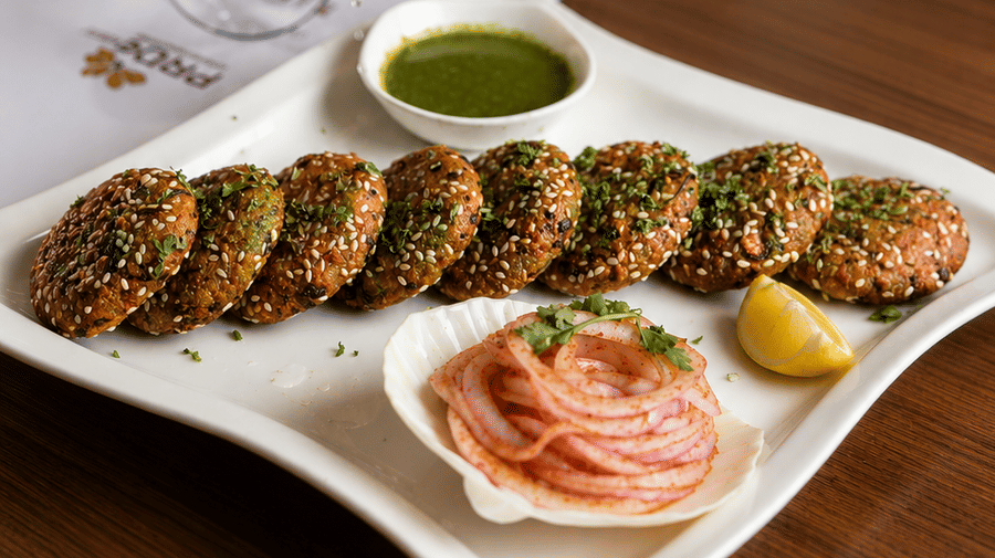 Chef garnishing appetisers with fresh ingredients at Pride Ashiyana Resort Mussoorie.