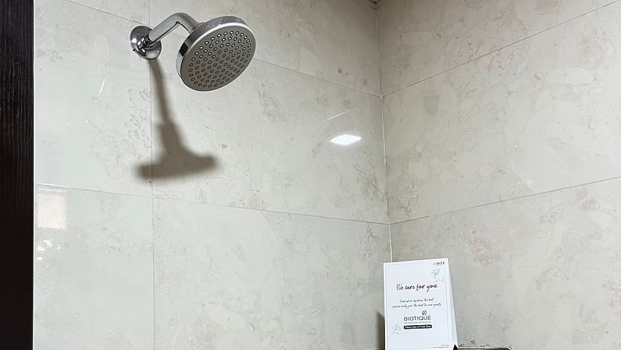 A shower head  in the hotel bathroom at VITS Select Kharadi, Pune.