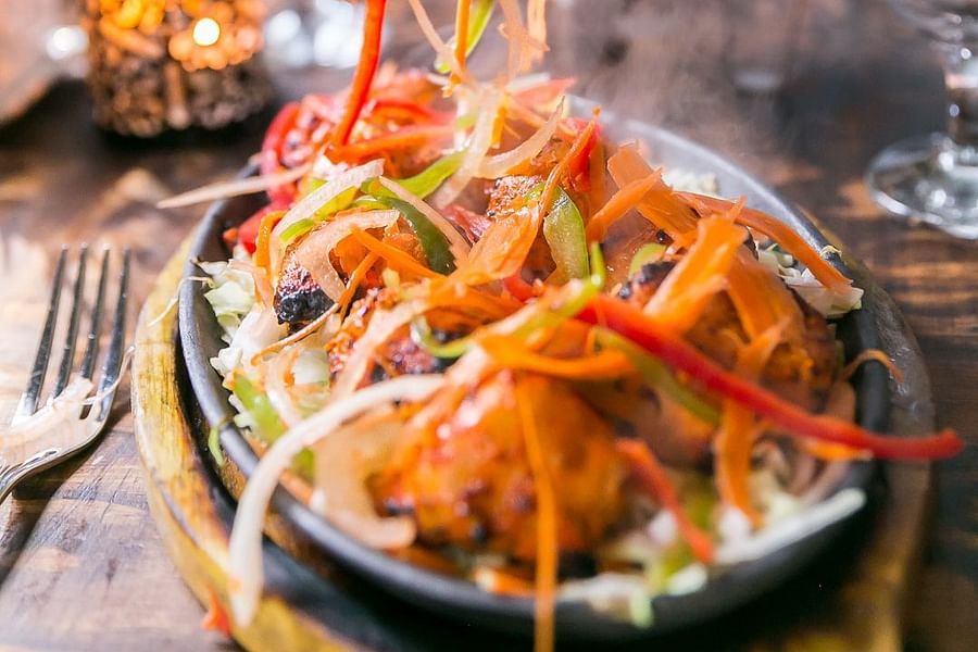 alt-text A close shot of a sizzling food item Sun Park Hotel & Banquet, Chandigarh - Zirakpur