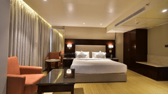 double bed in one of the rooms at Citadel Sarovar Portico, Bangalore 3