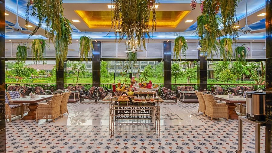 indoor seating space at tea pot - Mayfair Tea Resort, Siliguri 