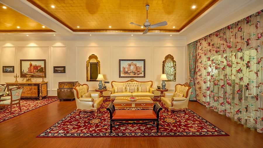 Luxurious Colonial  Room with elegant seating, chandelier lighting, and traditional decor.