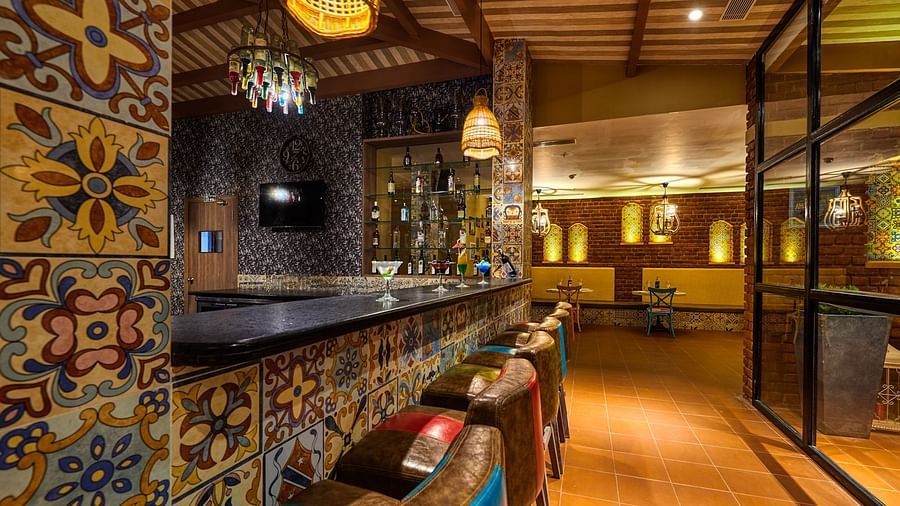 Bar counter with a vibrant theme at Swosti Chilika Resort