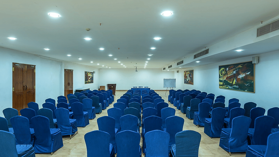 Orchid Hall arranged in theatre-style seating with blue chairs at Chariot Beach Resorts, perfect for large conferences and seminars.