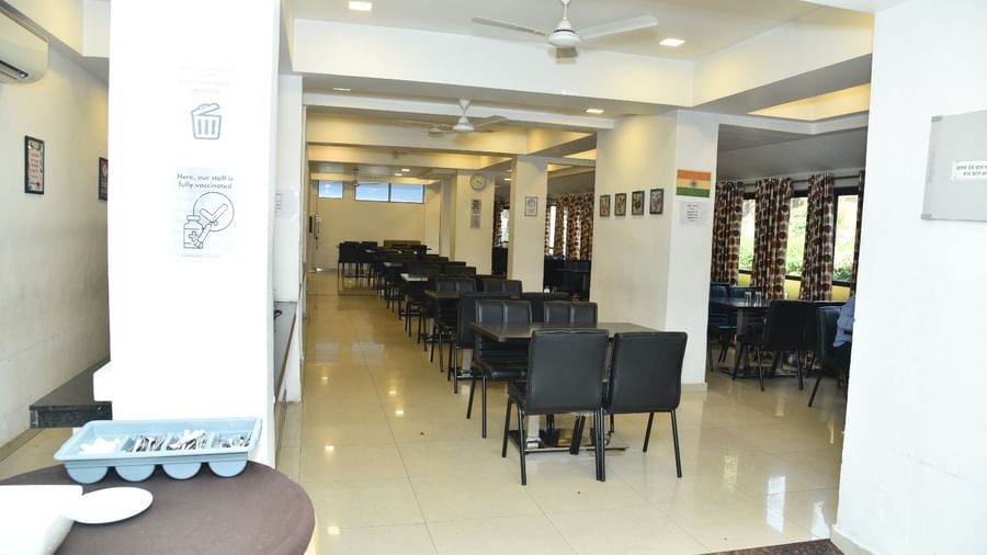 The Darbar Restaurant at Highland Resort features dining tables, and ample lighting.