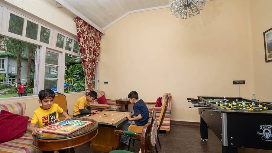 Children playing in the indoor game room at Summit Barsana Resort & Spa, Kalimpong