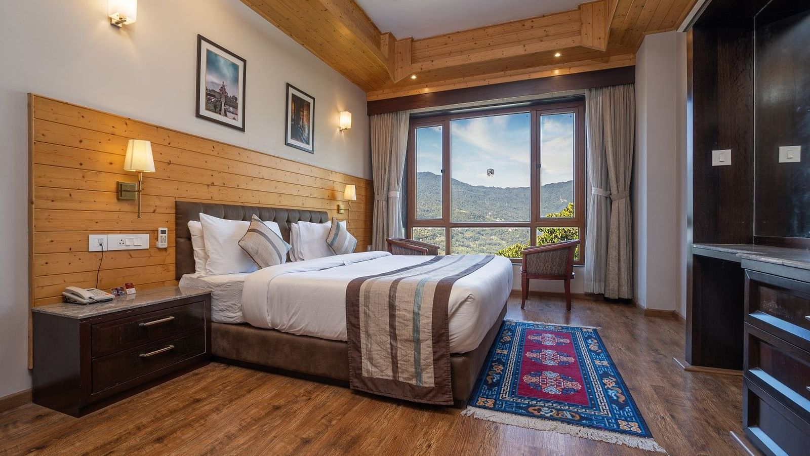 A room at Summit Alpine Abode with a double bed and mountain views