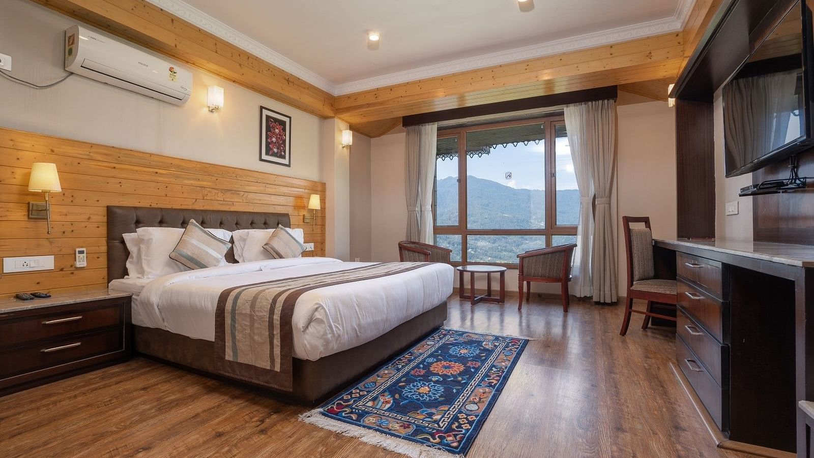 A room at Summit Alpine Abode with a double bed and mountain views
