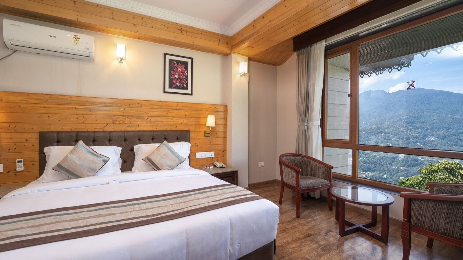 A room at Summit Alpine Abode with a double bed and mountain views
