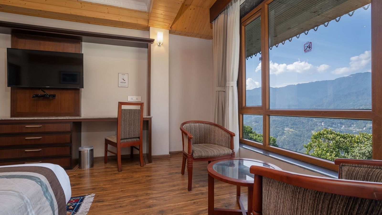 A room at Summit Alpine Abode with a double bed and mountain views