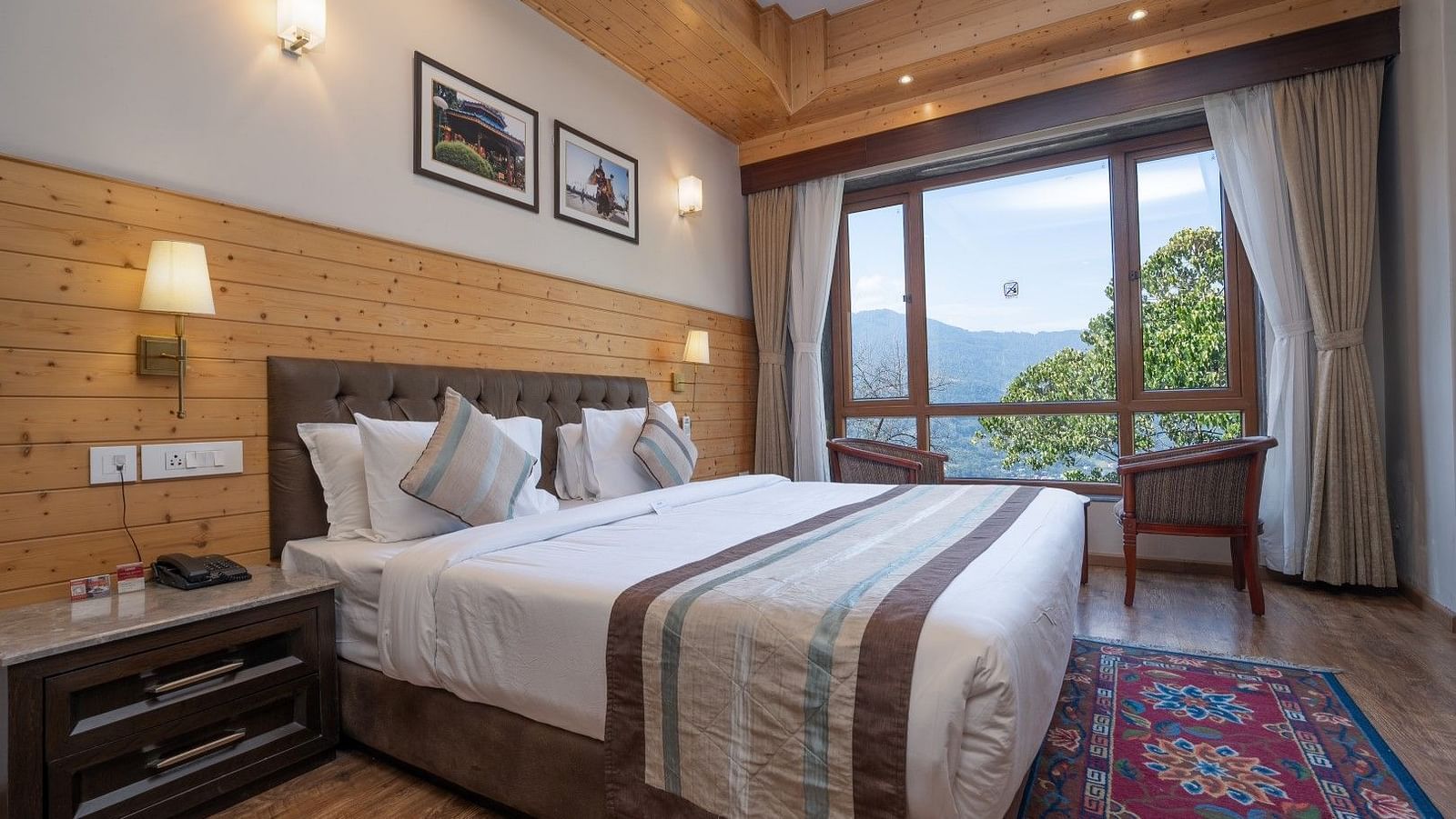 A room at Summit Alpine Abode with a double bed and mountain views