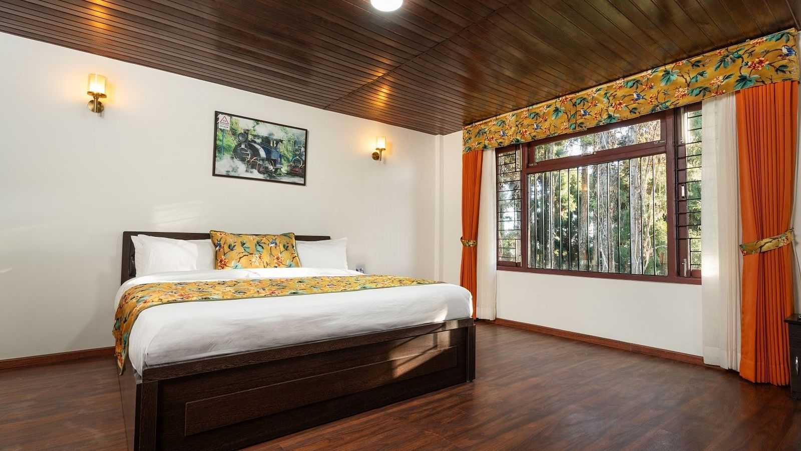 Image of a room with bed and wooden ceiling and flooring at Summit Sherpa Mountain Hotel & Spa, Kalimpong