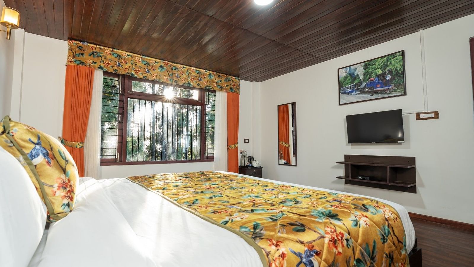 Image of a room with bed and wooden ceiling at Summit Sherpa Mountain Hotel & Spa, Kalimpong