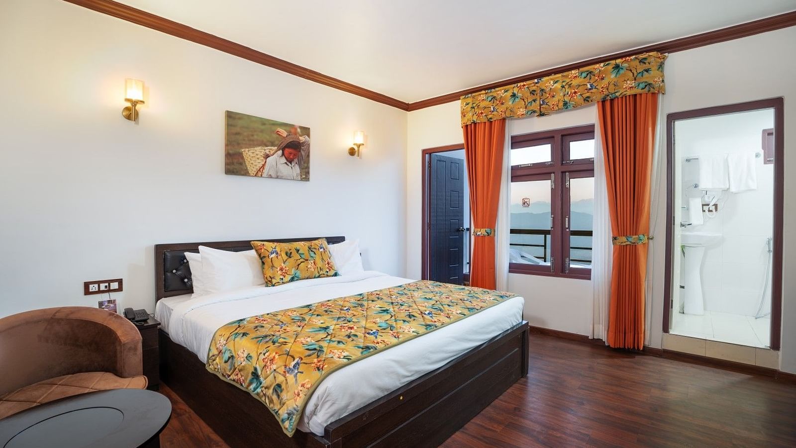 Image of a room with a bed and seating area at Summit Sherpa Mountain Hotel & Spa, Kalimpong