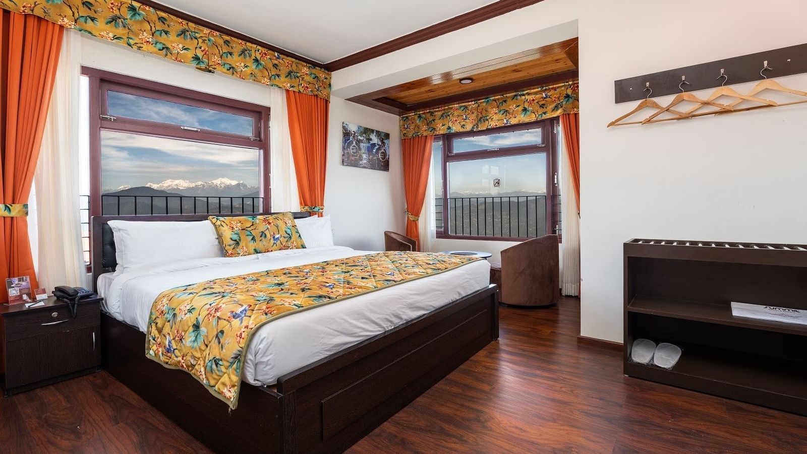Image of a room with bed and woooden flooring at Summit Sherpa Mountain Hotel & Spa, Kalimpong
