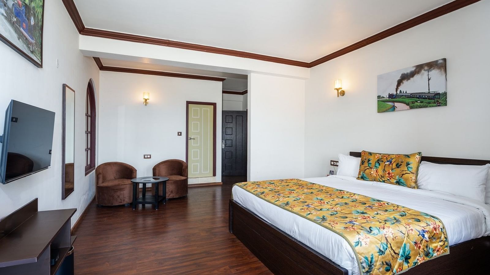 Image of a room with bed and seating area at Summit Sherpa Mountain Hotel & Spa, Kalimpong