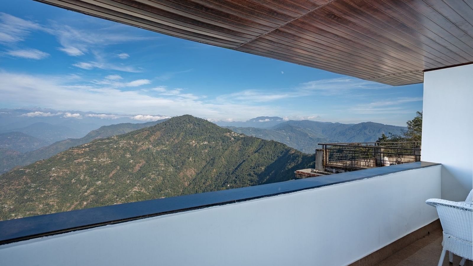 Image of a balcony with view of the lush mountains at Summit Sherpa Mountain Hotel & Spa, Kalimpong