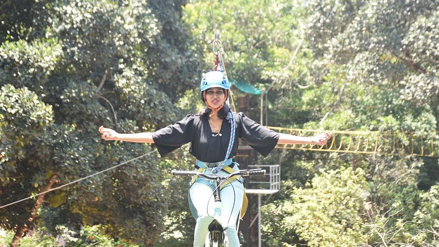 A woman enjoying sky cycling activity - Evergreen County