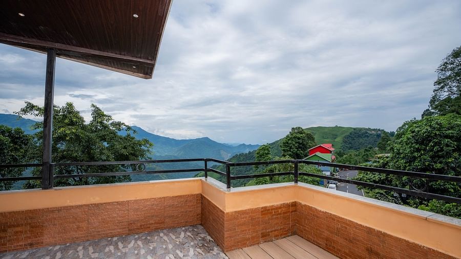 Premium Suite with a balcony; the spacious balcony offers an excellent view of nature.
