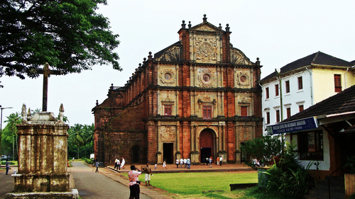 The exterior of the Basilica of Bom Jesus with a manicured garden in front of it. This church is one of the serene places to explore in South Goa.