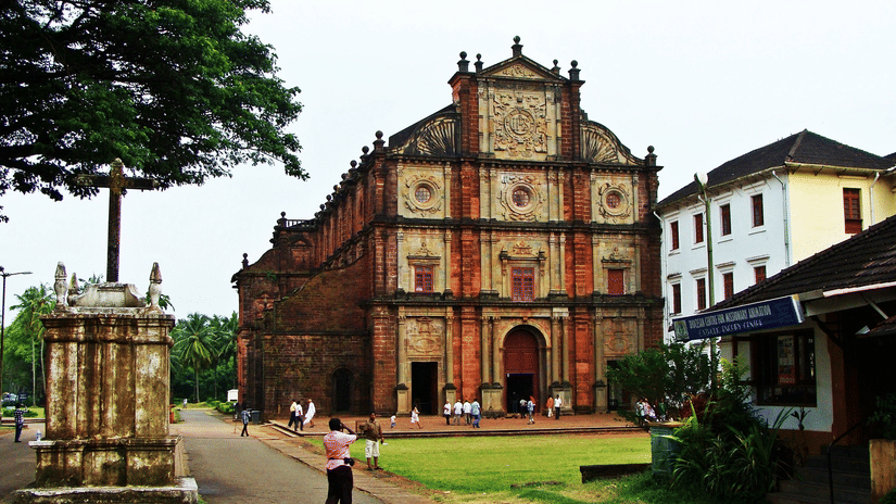 The exterior of the Basilica of Bom Jesus with a manicured garden in front of it. This church is one of the serene places to explore in South Goa.