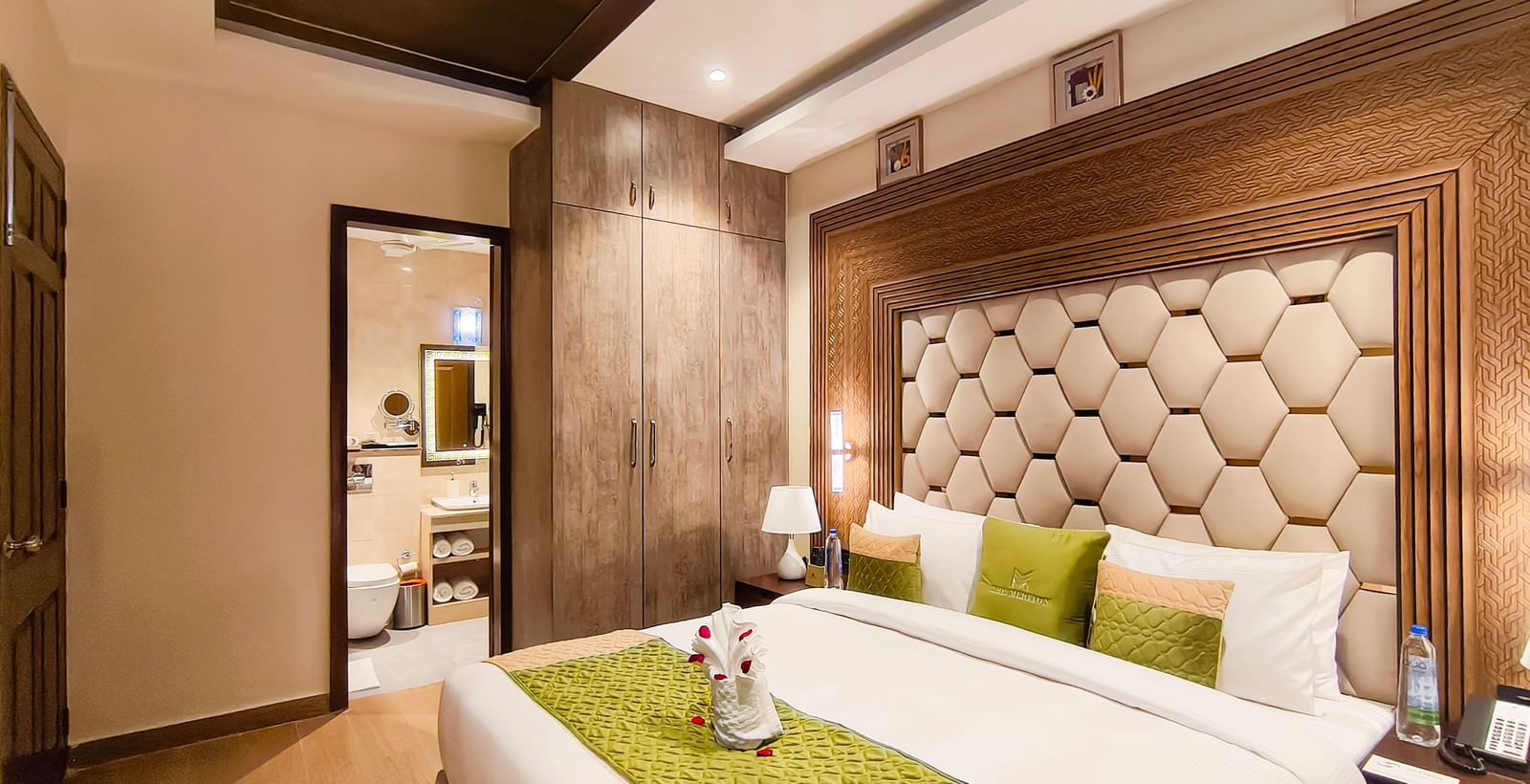 Spacious Junior Suite at The Meriton, New Delhi with elegant interiors and king-size bed