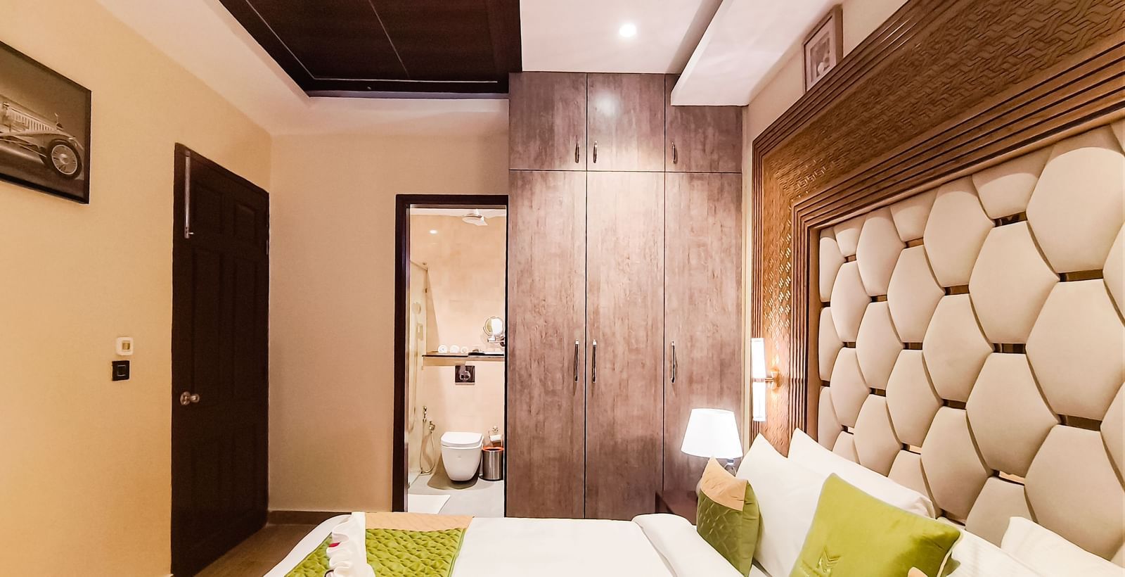 Luxury Junior Suite at The Meriton, New Delhi with modern décor and cozy seating area