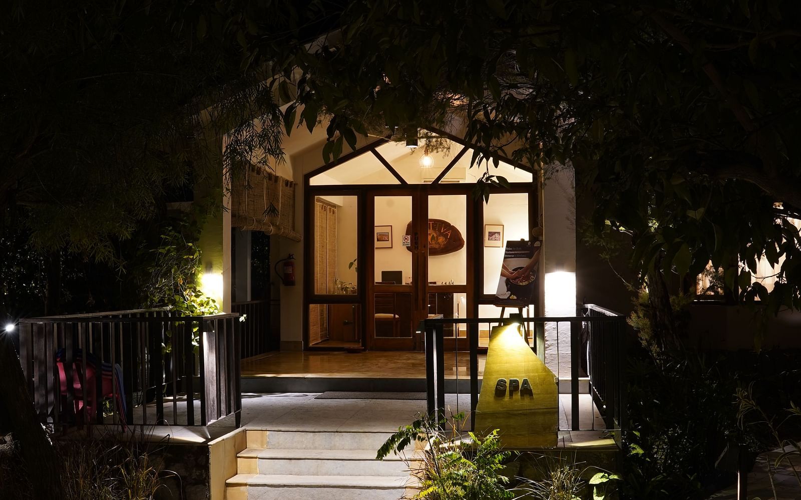 Entrance to the spa at Saraca Resort & Spa Corbett at night