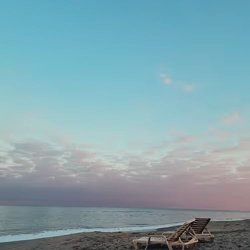 reclining chairs near a beach