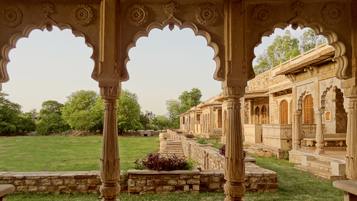 Deo Bagh - 17th Century, Gwalior - view of the garden in between the arches of a hallway 2