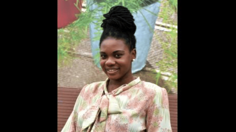 A community member smiling outdoors, representing individuals positively impacted by the S Hotel Foundation’s outreach and support programmes aimed at improving local livelihoods in Jamaica.