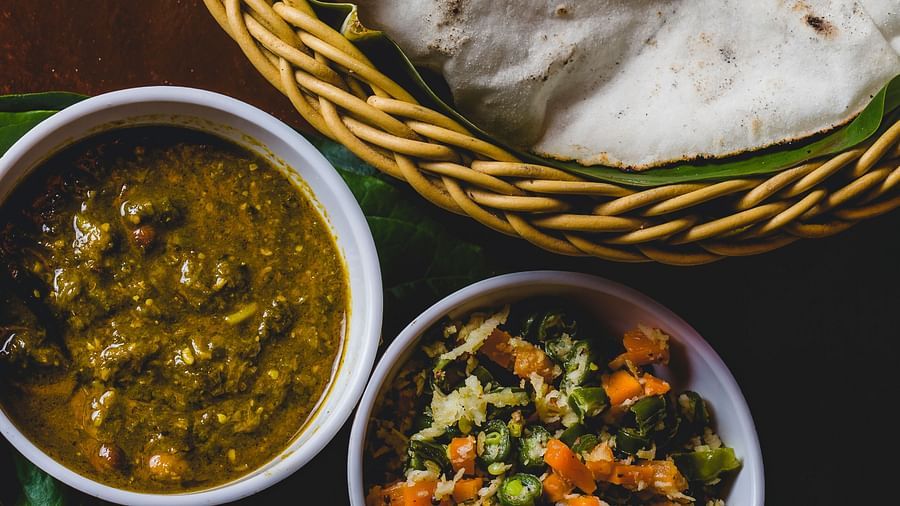 Rice roti with sides of veg and curry in bowls at The canopy, Capitol Village Resort, Madikeri