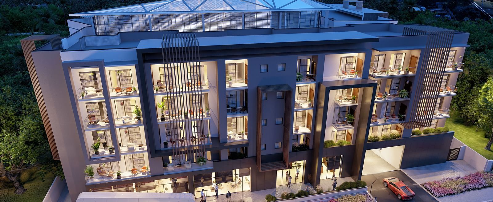 Aerial view of The Pelican Hotel, Accra during twilight with the lights on.