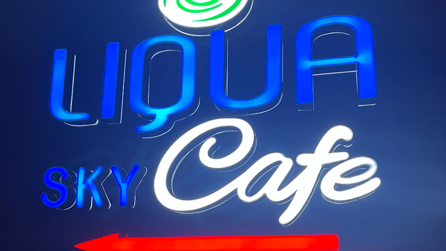 Cafe logo with a direction pointing arrow - Senses Hotel