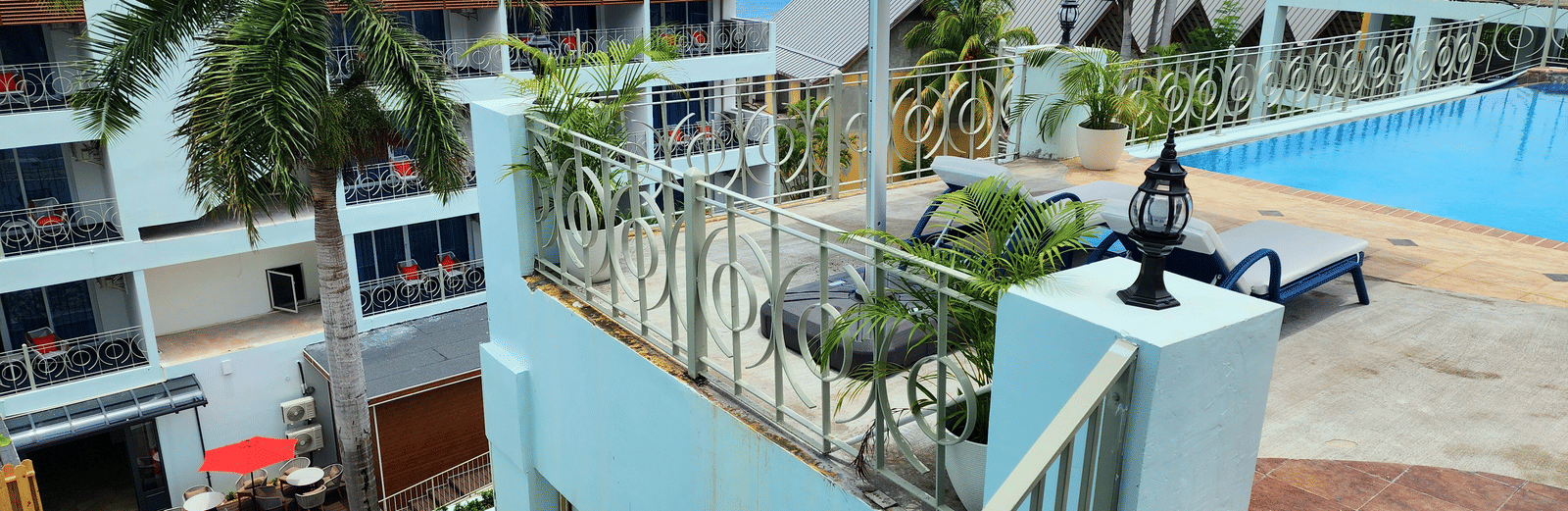A staircase leading to the rooftop swimming pool at hotel in Montego Bay - Hotel 39, Jamaica, A Family Hotel in Jamaica