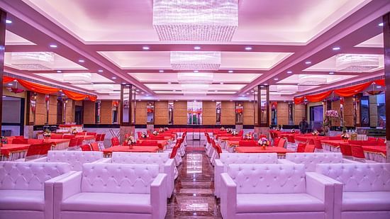 A front view of a banquet hall with sofas placed in a classroom seating style Sun Park Hotel & Banquet, Chandigarh - Zirakpur
