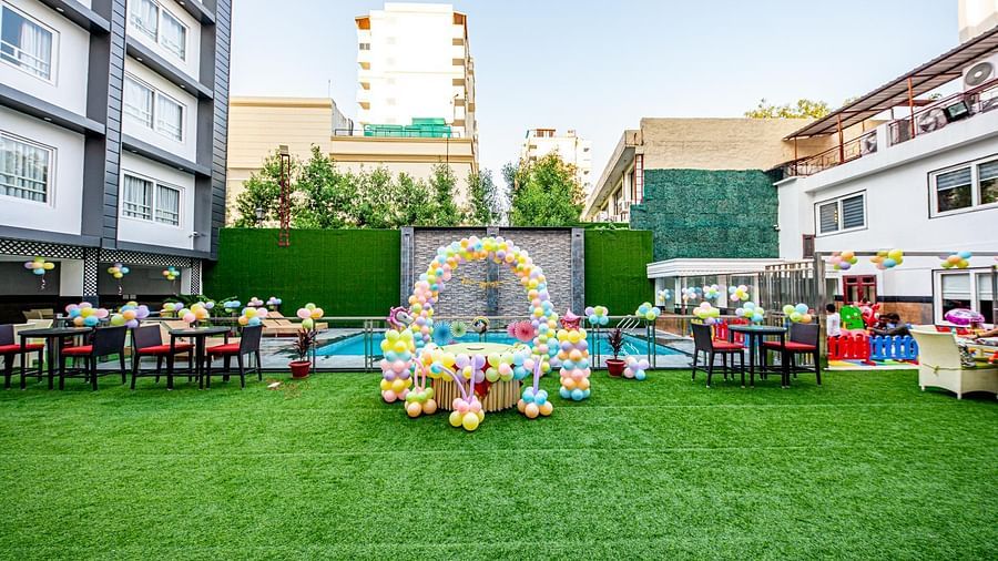 A wide view of an open event space beside a swimming pool Sun Park Hotel & Banquet, Chandigarh - Zirakpur