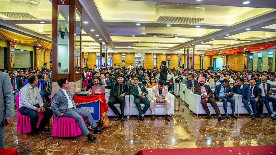 A front view of a conference hall with multiple chairs occupied by poeple Sun Park Hotel & Banquet, Chandigarh - Zirakpur