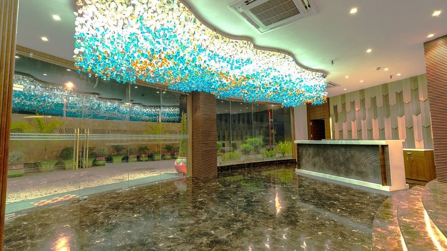 an image of a lobby area with a reception desk at Clarks Inn Suites, Hyderabad