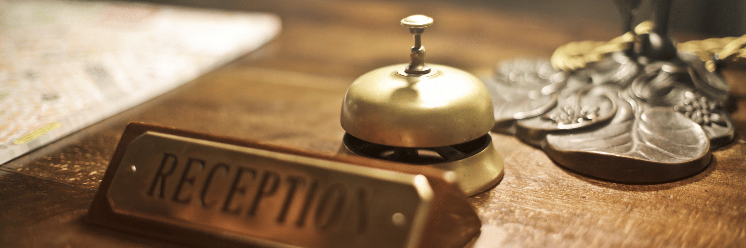 A close up shot of a desk with a plate having reception written on it.