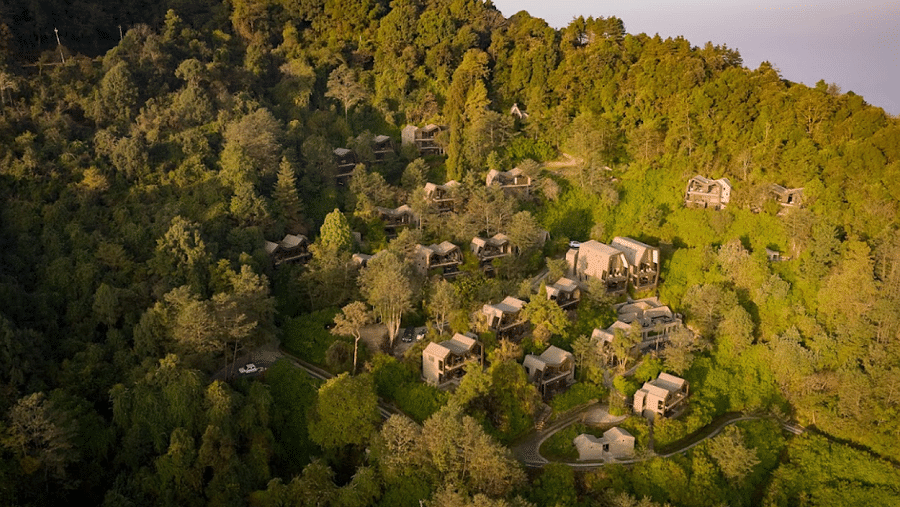 A small town with several homes, valleys and mountains in the background | Kavya Resort and Spa, Nagarkot