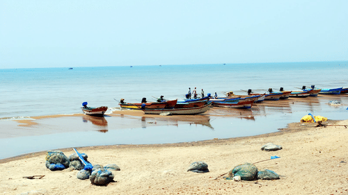 Boats queued up on the beachside, one of the scenic sights among Tharangambadi tourist places.