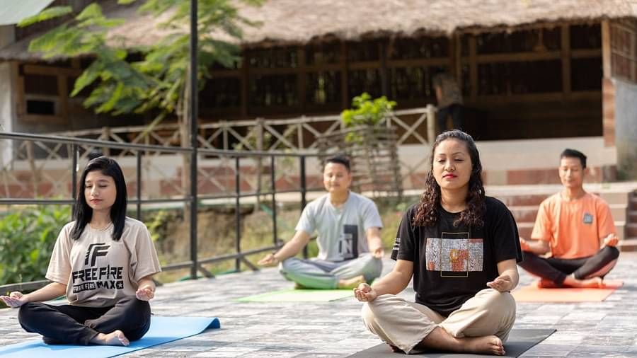 People meditating at Summit Green Lake Tea Resort & Spa, Kaziranga