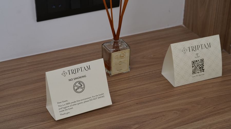 reed diffuser and notices in one of the rooms at Triptam Hotel, Vrindavan