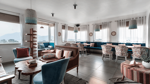 an overview of the restaurant with seats and tables - The Sierra, Udaipur